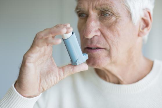 Man using inhaler 
