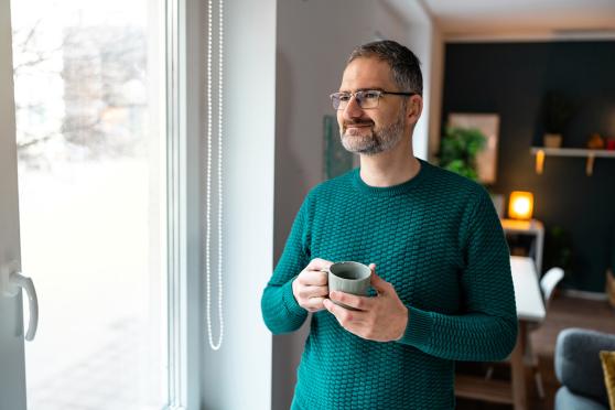 Man looking out the window