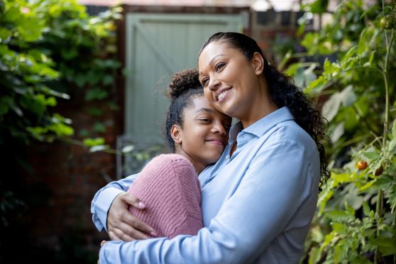 Mother and daughter hugging
