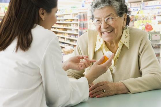 Woman speaking to a pharmacist